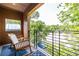Relaxing balcony seating with scenic views of lush greenery and community amenities at 112 Rogers St # 208, Atlanta, GA 30317