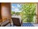 Inviting balcony featuring comfortable rocking chairs and a serene outdoor view at 112 Rogers St # 208, Atlanta, GA 30317
