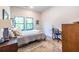 Cozy bedroom with neutral tones, natural light, and a functional workspace at 112 Rogers St # 208, Atlanta, GA 30317
