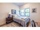 Comfortable bedroom with ample natural light, wooden floors, and modern decor at 112 Rogers St # 208, Atlanta, GA 30317