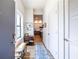 Inviting entryway with a bench and view of the kitchen at 112 Rogers St # 208, Atlanta, GA 30317