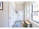 Bright entryway with shoe rack, blue rug, and natural light, offering a welcoming space at 112 Rogers St # 208, Atlanta, GA 30317