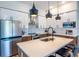 Modern kitchen with white and wood cabinets, stainless steel appliances, and quartz countertops at 112 Rogers St # 208, Atlanta, GA 30317