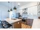 Well-equipped kitchen with stainless steel appliances, quartz counters, and island seating at 112 Rogers St # 208, Atlanta, GA 30317