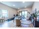 Spacious living room with hardwood floors, a balcony view, and contemporary furniture at 112 Rogers St # 208, Atlanta, GA 30317