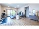 Cozy living room featuring hardwood floors, a sliding door to balcony, and modern decor at 112 Rogers St # 208, Atlanta, GA 30317