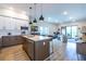 Open concept living room and kitchen with island and stainless steel appliances at 112 Rogers St # 208, Atlanta, GA 30317
