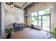 Stylish lobby area with modern lighting, table and chairs, and a large window at 112 Rogers St # 208, Atlanta, GA 30317