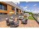 Outdoor living on this rooftop deck with comfortable seating around a central fireplace, perfect for entertaining at 112 Rogers St # 208, Atlanta, GA 30317