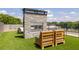 Outdoor fireplace on a rooftop deck with green turf, providing a cozy gathering spot at 112 Rogers St # 208, Atlanta, GA 30317