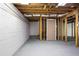Unfinished basement area with painted walls and exposed ceiling insulation offers space for custom design at 1350 Overlook Se Cv, Smyrna, GA 30080
