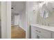 Well-lit bathroom with a bright vanity and hardwood floors just outside the door at 1350 Overlook Se Cv, Smyrna, GA 30080