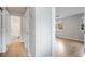 Hallway provides access to a bedroom with hardwood flooring, and a bathroom with patterned tile flooring at 1350 Overlook Se Cv, Smyrna, GA 30080