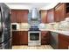 Modern kitchen boasts stainless steel appliances, updated cabinets, stylish backsplash, and durable countertops at 1350 Overlook Se Cv, Smyrna, GA 30080