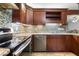 Renovated kitchen showcasing stainless steel appliances and modern backsplash at 1350 Overlook Se Cv, Smyrna, GA 30080