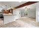 Spacious living area with hardwood flooring, ceiling fan, and bright windows merging the kitchen and living spaces at 1350 Overlook Se Cv, Smyrna, GA 30080