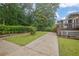 Spacious backyard with a defined grassy area and paved patio, perfect for outdoor living at 4457 Huntshire Dr, Stone Mountain, GA 30083