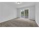 Spacious bedroom with a sliding glass door to the outdoor deck area at 4457 Huntshire Dr, Stone Mountain, GA 30083