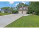 Charming two-story home with a two-car garage and expansive driveway on a verdant lot at 4457 Huntshire Dr, Stone Mountain, GA 30083