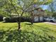 Inviting split-level home with a well-manicured lawn and ample parking on the driveway at 4457 Huntshire Dr, Stone Mountain, GA 30083