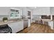 Well-lit kitchen with white cabinetry, breakfast bar, and stainless steel appliances at 4457 Huntshire Dr, Stone Mountain, GA 30083