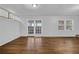 Spacious living room with hardwood floors and door to outside at 4457 Huntshire Dr, Stone Mountain, GA 30083