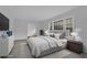 Serene main bedroom featuring soft carpet, and large windows for natural light at 4457 Huntshire Dr, Stone Mountain, GA 30083