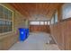 Covered brick and wood patio area, offering a sheltered outdoor space at 4457 Huntshire Dr, Stone Mountain, GA 30083