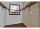 Walk-in closet with wooden shelves and window providing natural light at 4457 Huntshire Dr, Stone Mountain, GA 30083