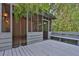 Charming screened back porch with seating area and an adjacent wooden deck at 11 Ardmore Nw Sq, Atlanta, GA 30309