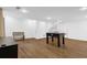 Finished basement with wood floors, foosball table, and neutral paint at 11 Ardmore Nw Sq, Atlanta, GA 30309