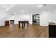 Finished basement with laminate floors, laundry area, storage, and a foosball table for recreation at 11 Ardmore Nw Sq, Atlanta, GA 30309