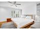Bright bedroom featuring natural light, a ceiling fan, and hardwood floors at 11 Ardmore Nw Sq, Atlanta, GA 30309