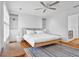 Bright bedroom featuring natural light, built in shelves, ceiling fan, and hardwood floors at 11 Ardmore Nw Sq, Atlanta, GA 30309