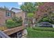Brick townhome with lush landscaping, covered parking, and a well-manicured exterior at 11 Ardmore Nw Sq, Atlanta, GA 30309
