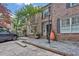 Charming brick townhouse with black shutters, bay windows, and beautifully landscaped front yard at 11 Ardmore Nw Sq, Atlanta, GA 30309