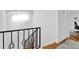Bright hallway with hardwood floors, detailed railings, and access to a well-lit office space at 11 Ardmore Nw Sq, Atlanta, GA 30309