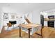 Bright living room features hardwood floors, a fireplace with built-in shelving, and an open floor plan at 11 Ardmore Nw Sq, Atlanta, GA 30309