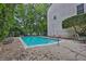 Refreshing outdoor pool with lounge chairs and a well-maintained concrete deck surrounded by lush greenery at 11 Ardmore Nw Sq, Atlanta, GA 30309