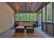 Cozy screened-in porch with comfortable seating and string lights, perfect for outdoor relaxation at 11 Ardmore Nw Sq, Atlanta, GA 30309