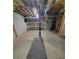 Unfinished basement with concrete floors and exposed ceiling features shelving and space for storage or customization at 129 Carolyn Path, Rockmart, GA 30153