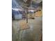 Spacious unfinished basement with exposed insulation and concrete floors offers ample potential for storage and customization at 129 Carolyn Path, Rockmart, GA 30153