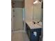 Bathroom featuring glass enclosed shower and single sink vanity at 129 Carolyn Path, Rockmart, GA 30153