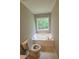Bathroom featuring large garden tub under window at 129 Carolyn Path, Rockmart, GA 30153
