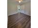 This large bedroom is spacious and features wood flooring and a double door closet at 129 Carolyn Path, Rockmart, GA 30153