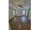 Spacious bedroom with wood-look floors, ceiling fan and neutral walls at 129 Carolyn Path, Rockmart, GA 30153