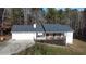 Ranch-style home featuring a large deck, two-car garage and wooded lot at 129 Carolyn Path, Rockmart, GA 30153