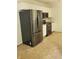 Well-equipped kitchen with stainless steel appliances and white cabinets at 129 Carolyn Path, Rockmart, GA 30153