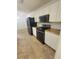 Bright kitchen with modern appliances, white cabinetry and butcher block countertops offers ample space at 129 Carolyn Path, Rockmart, GA 30153