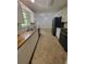 Spacious kitchen featuring tile backsplash, stainless steel sink, and modern appliances at 129 Carolyn Path, Rockmart, GA 30153